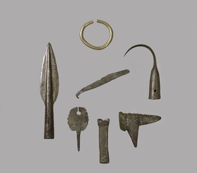 A hoard of ornaments and implements, from Fresn-la-Mere, France, Bronze Age gold and bronze by Bronze Age